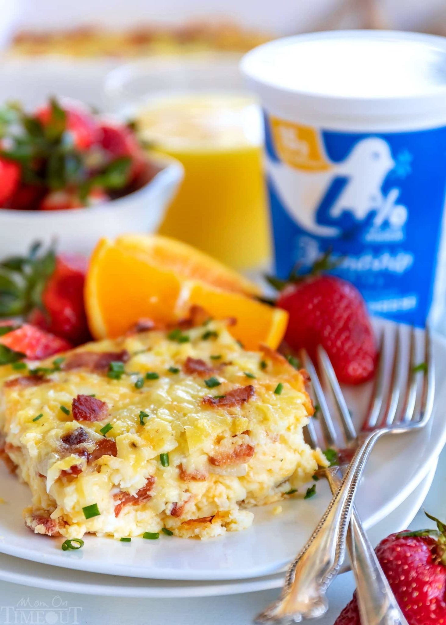 Delicious gourmet breakfast spread for a large crowd with eggs, pastries, and fruit